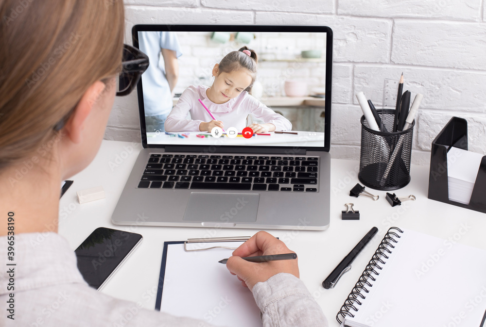 Unrecognizable woman having videocall with her daughter, using laptop Unrecognizable woman having videocall with her daughter, using laptop