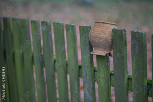 old pots hung on the fence