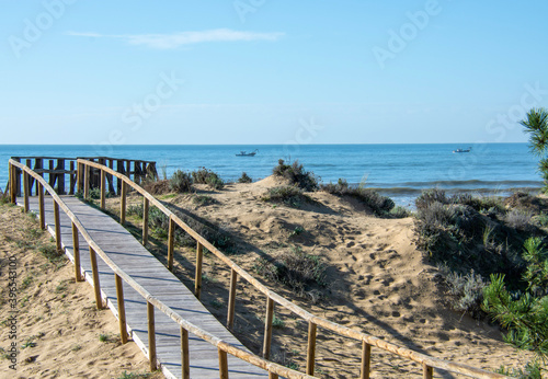 Fototapeta Naklejka Na Ścianę i Meble -  wooden bridge on the beach