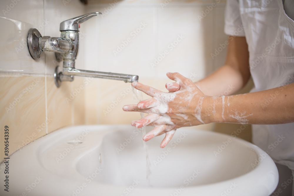 Hands washing. Person washing their hands with soap. Doctor washing