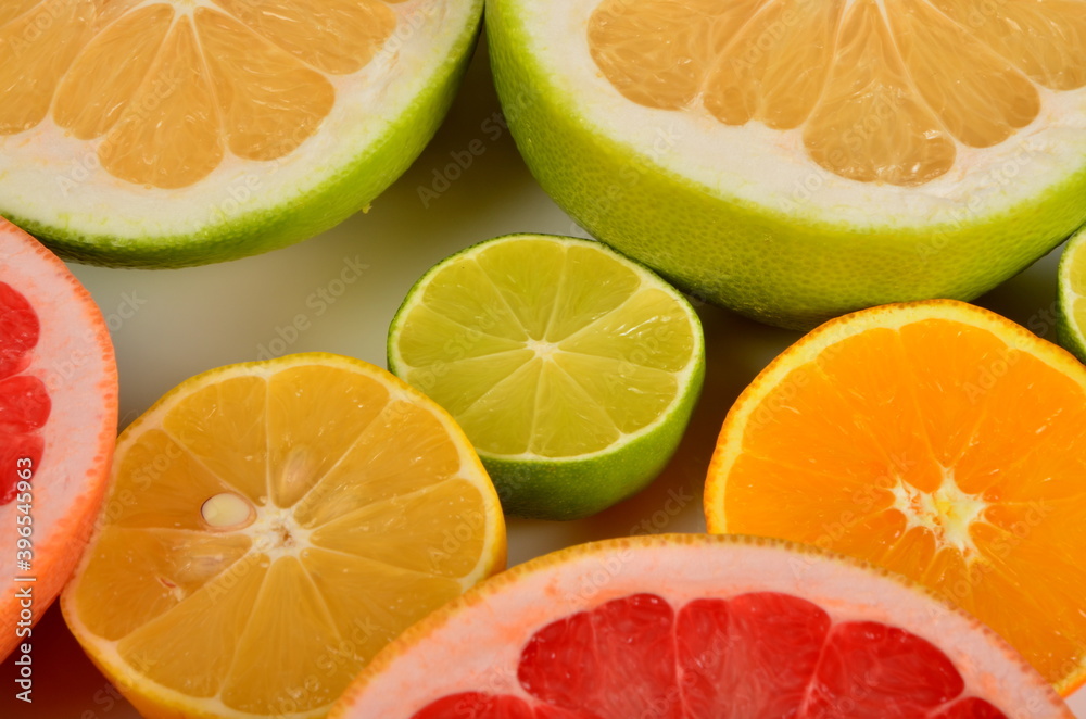 Close-up of sliced citrus fruits, Various citrus fruits, Citrus background Close-up of sliced citrus fruits, Various citrus fruits, Citrus background
