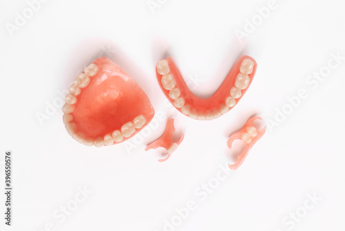Dentures on a white background. Close-up of dentures. Dentistry is conceptual photography. Prosthetic dentistry. False teeth. Prosthetics. Close-up of plastic dentures. Teeth on a white background