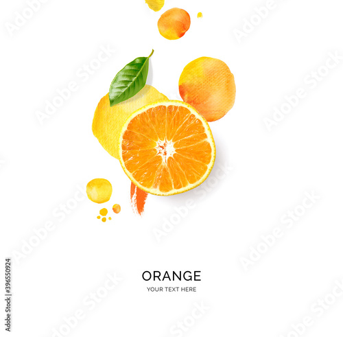 Creative layout made of orange with watercolor spots on the white background. Flat lay. Food concept. photo