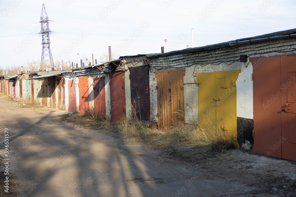 a row of garages with colorful gates