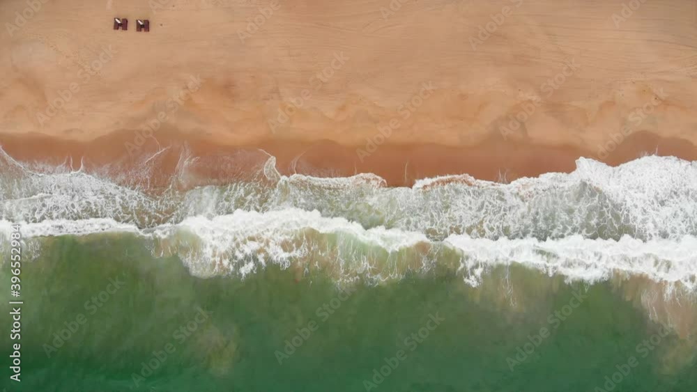 Aerial drone shot view the ocean of the ocean waves, beautiful waves do not end frames one by one while the turquoise sea waves break on the sandy coast. 4K Aerial drone shot view the ocean of the ocean waves, beautiful waves do not end frames one by one while the turquoise sea waves break on the sandy coast. 4K