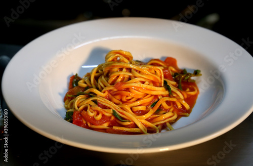 Pasta in Italian restaurant. Spaghetti with background
