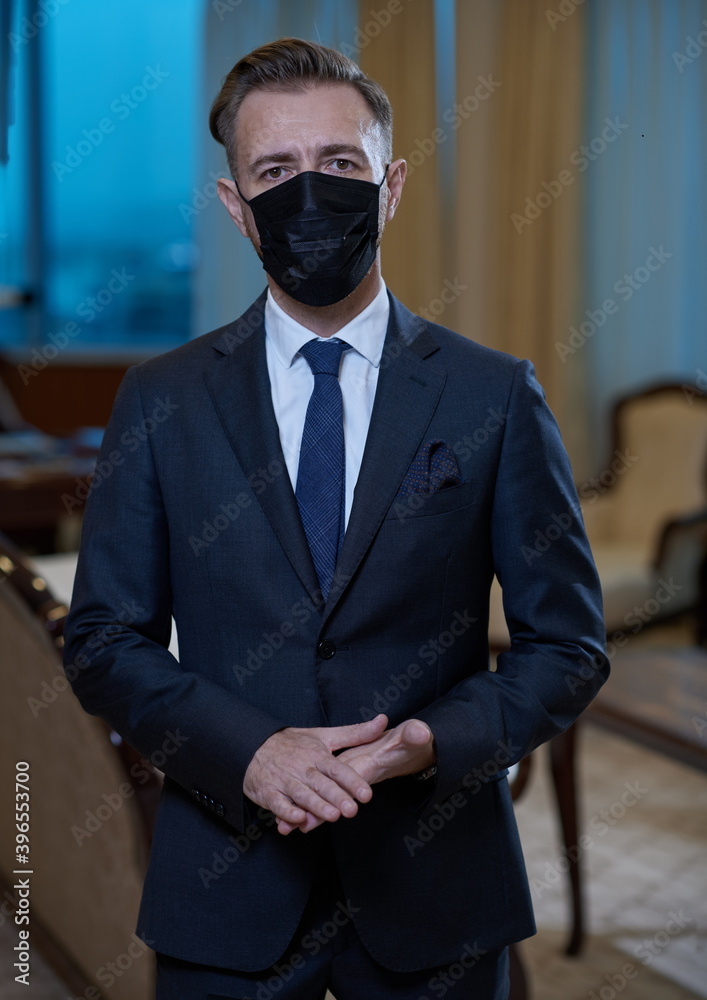 business man wearing protective face mask at office
