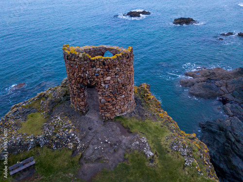 Aerial shot of the Lady Janet Tower, this ancient tower is located at the Fife Coastal Path just outside of Elie. photo