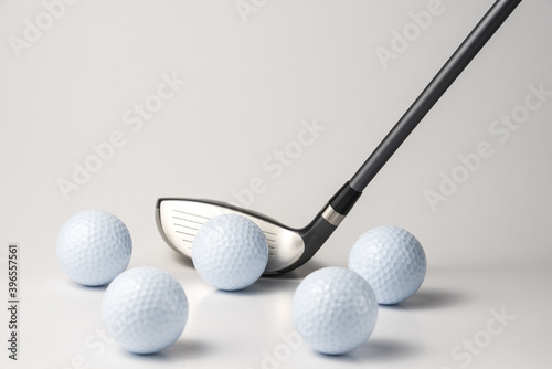 golf club and ball on white background