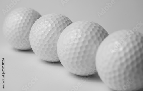 golf club and ball on white background