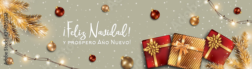 Feliz Navidad. Spanish Christmas Background with Gift box, Balls decoration and Greeting Text of Winter Holidays