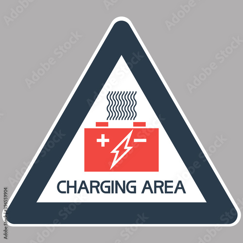 Battery charging area.
Triangular sign with textual information, two-color, flat image.