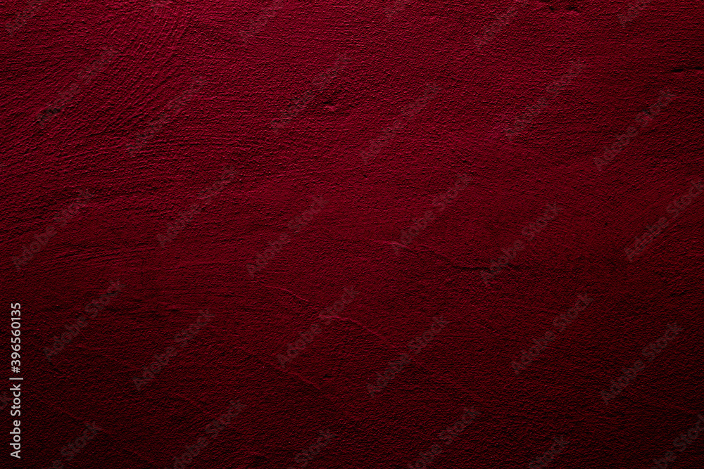 Fototapeta premium Crimson abstract textured wall background in red