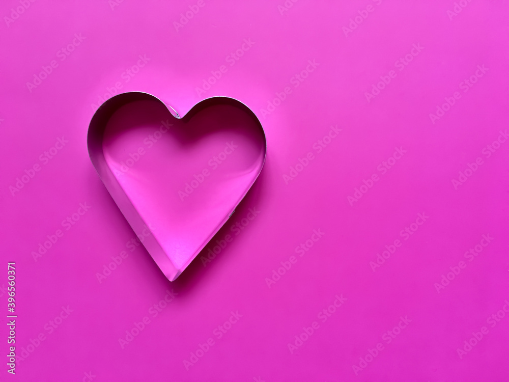 Valentine's day background.  Pink heart on a pink background.  Love concept.  Flat lay, copy space.  Card .