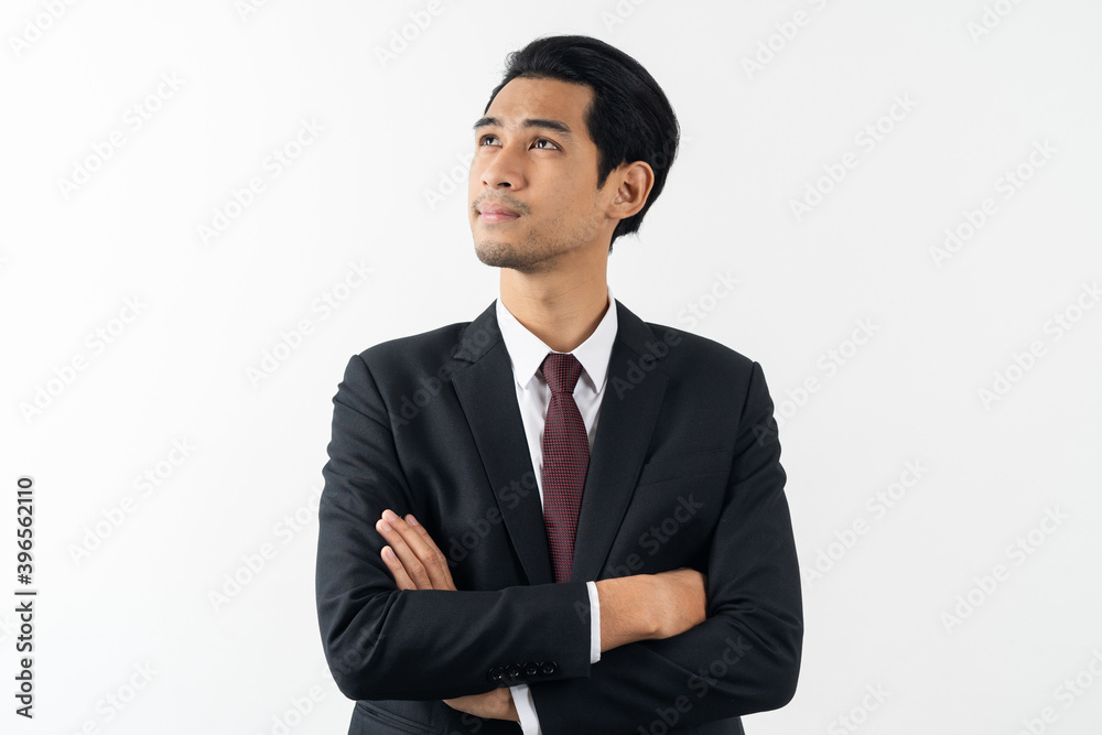 happy young asian businessman smiling and thinking in formal suit isolated on white background. happy young asian businessman smiling and thinking in formal suit isolated on white background.