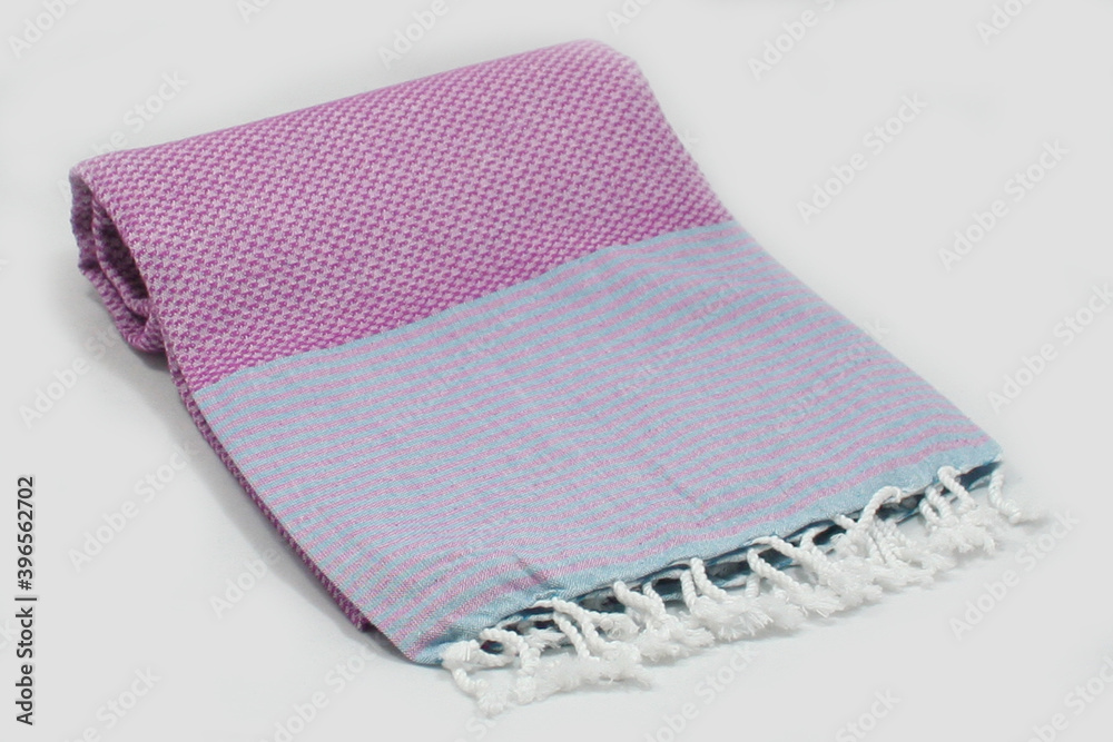 Peshtemal Turkish bath cotton towel folded textile. Beautiful bright colors with natural light background. Perfect online market digital shop sales.
