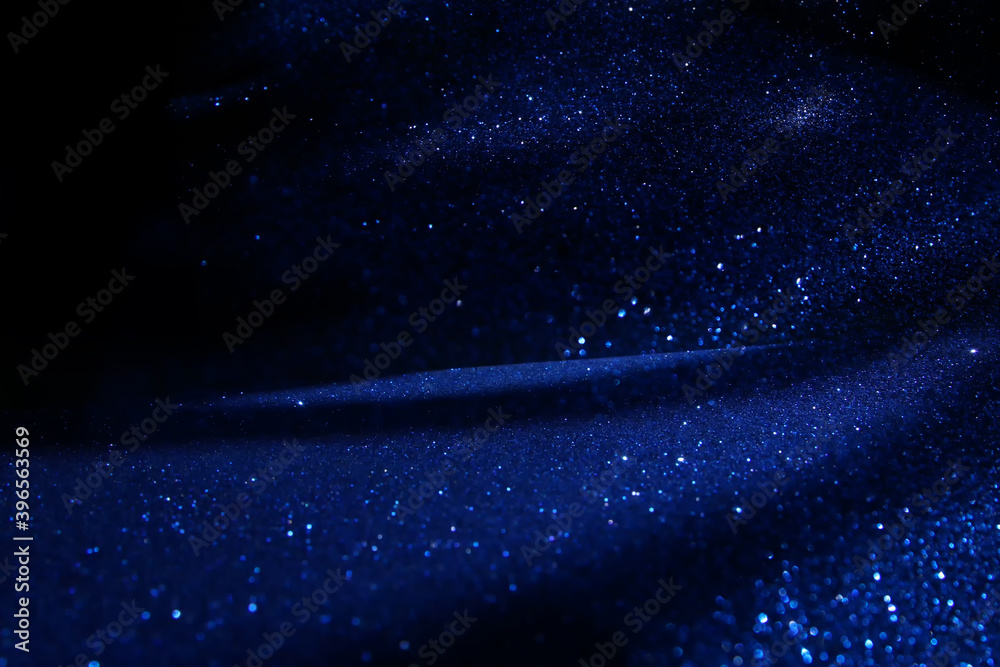 Obraz premium background of abstract glitter lights. silver, blue and black. de focused