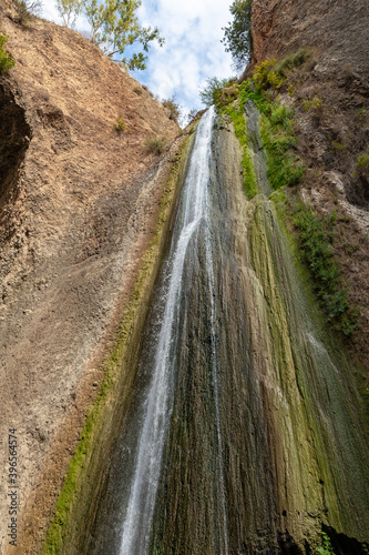 HaTanur waterfall flows from a crevice in the mountain and is located in the continuation of the rapid, shallow, cold mountain Ayun river in the Galilee in northern Israel