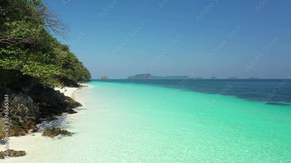 Aerial view of ocean waves, beach and rocky coastline and beautiful forest. Nyaung Oo Phee Island Myanmar. Summer travel concept Aerial view of ocean waves, beach and rocky coastline and beautiful forest. Nyaung Oo Phee Island Myanmar. Summer travel concept