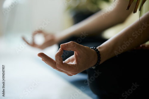 close-up of yoga mudra with male arms