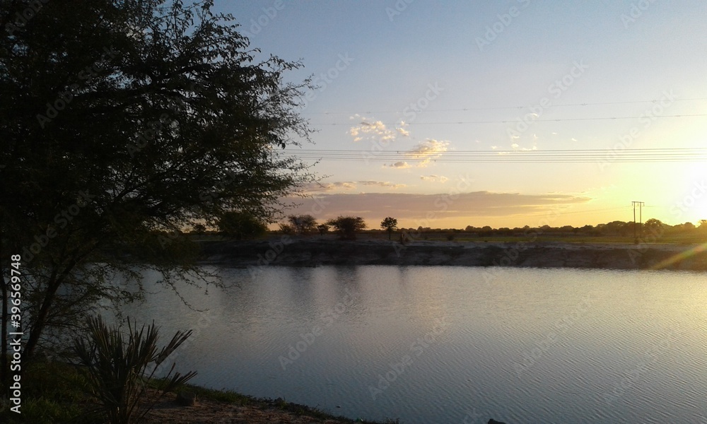 sunset over the oshana water pan.