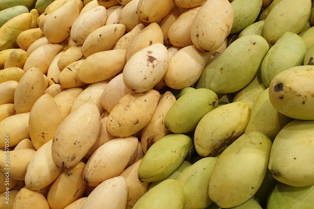 Fresh mangoes from Thailand display on market stall for sale Fresh mangoes from Thailand display on market stall for sale