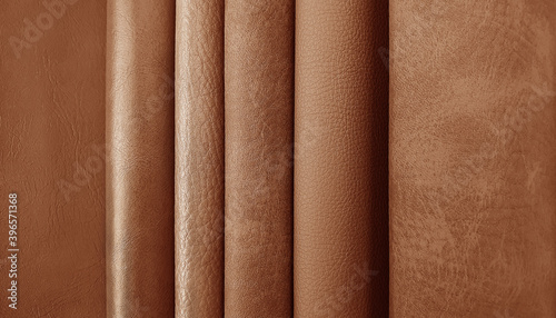 close up leather fabric samples catalog for interior uphostery works in elite brown tone color. photo