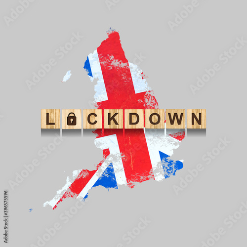 Lockdown. England. The inscription on wooden blocks, against the background of the map of England. Closing the country for quarantine. Isolated.