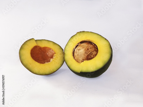 Avocado or alligator pear on a white background, famous brazilian fruit, found in South America and Mexico. Guacamole ingredient. 