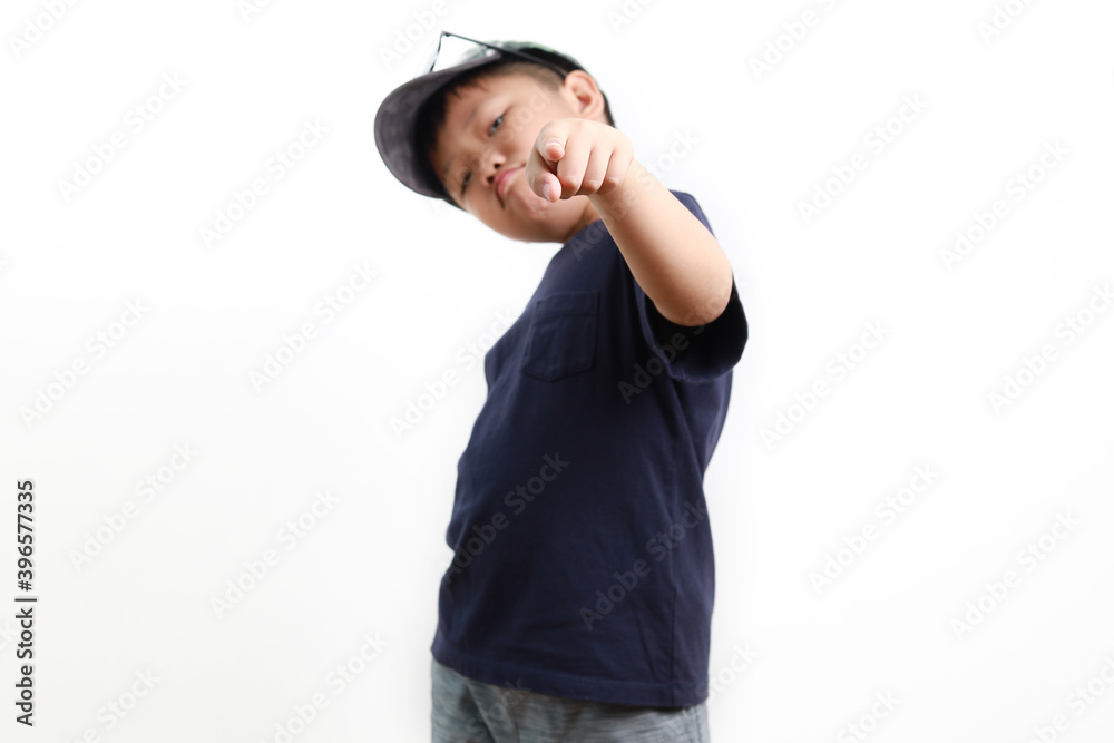 Stylish cute little Asian boy wearing cap and sunglasses posing on white background Stylish cute little Asian boy wearing cap and sunglasses posing on white background