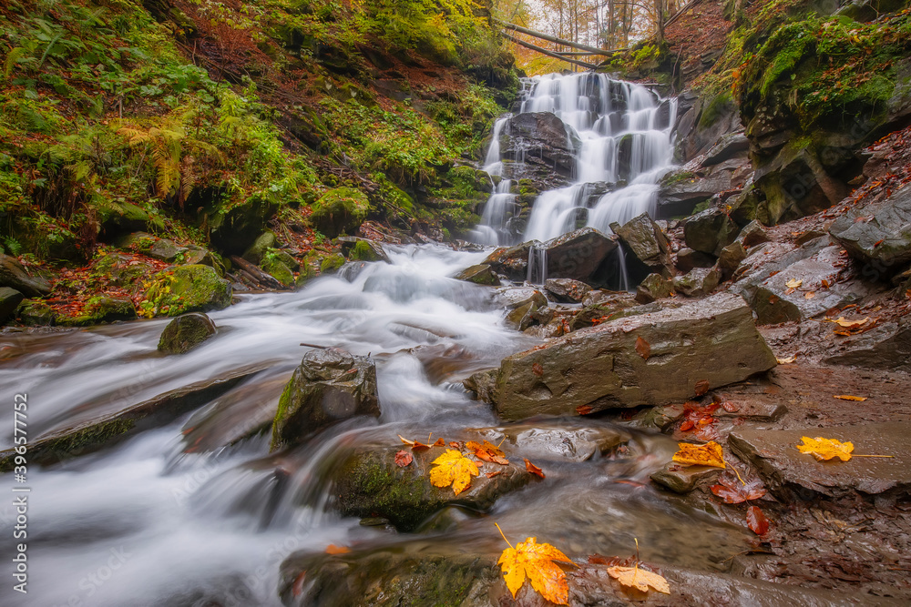 Beautiful waterfall in the forest, fall season outdoor background
