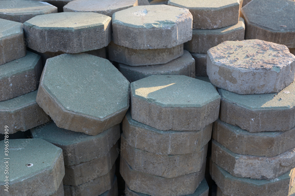 Stack of hexagonal concrete paving with morning sunshine. Stack of hexagonal concrete paving with morning sunshine.