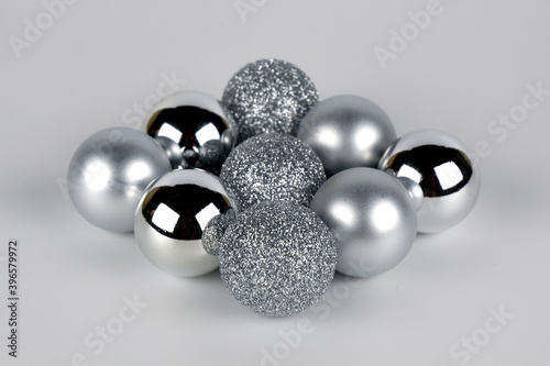 Silver christmas balls in a diamond shape close up view selective focus