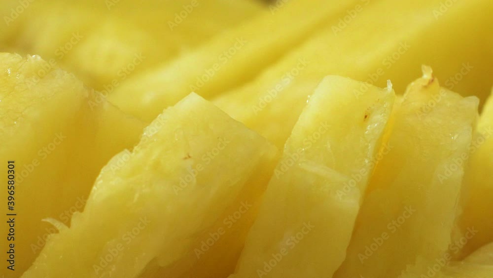 Close-up of freshly cut pineapple bits, tilt up Close-up of freshly cut pineapple bits, tilt up