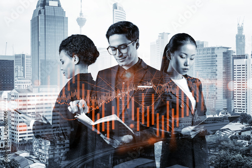Photography Group of business colleagues in suits as a part of multinational corporate team working on forecasting trading corporate strategy at fund