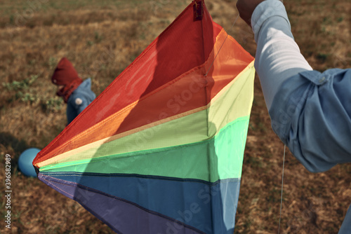 A man with a two-year-old child is flying a kite. Games with children, fatherhood