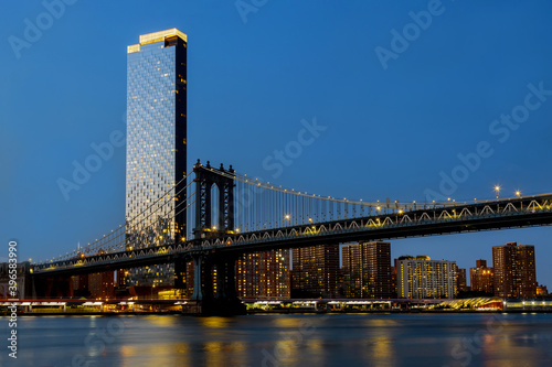 Beautiful view to Manhattan bridge New York City awesome wide angle upward view long exposure during evening rush hour