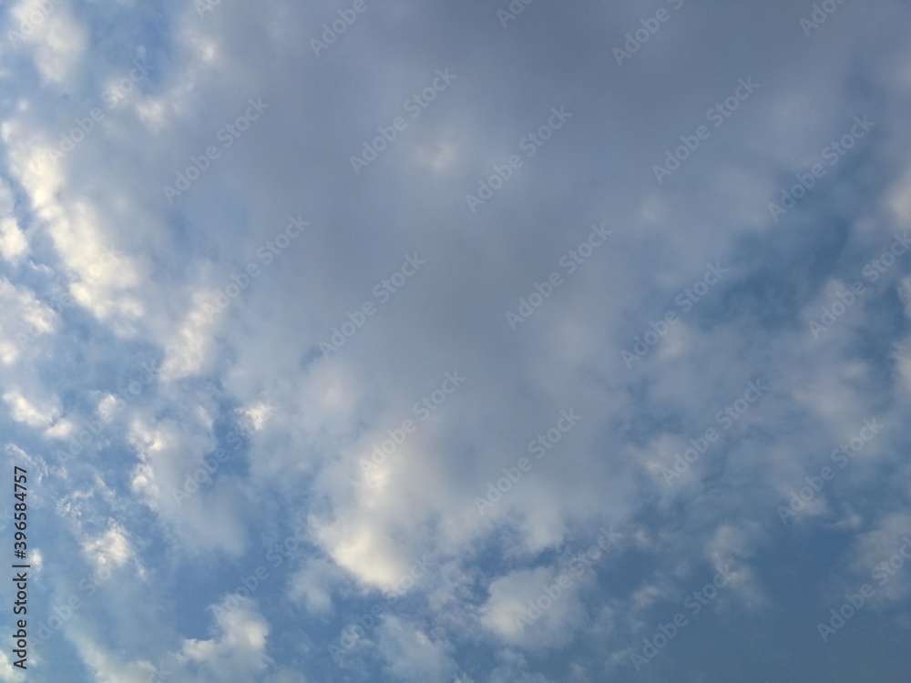 Only sky, blue sky with fluffy clouds