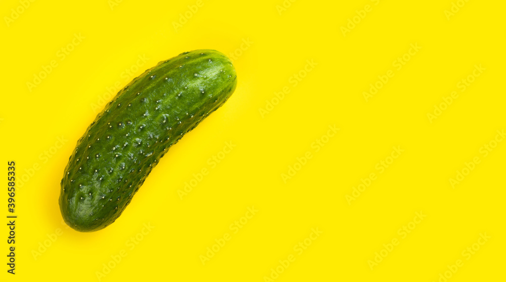 Fresh cucumber isolated on yellow background