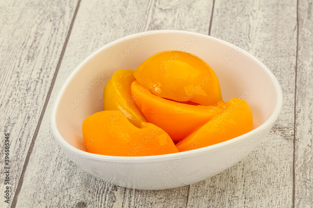 Marinated peaches fruit in the bowl