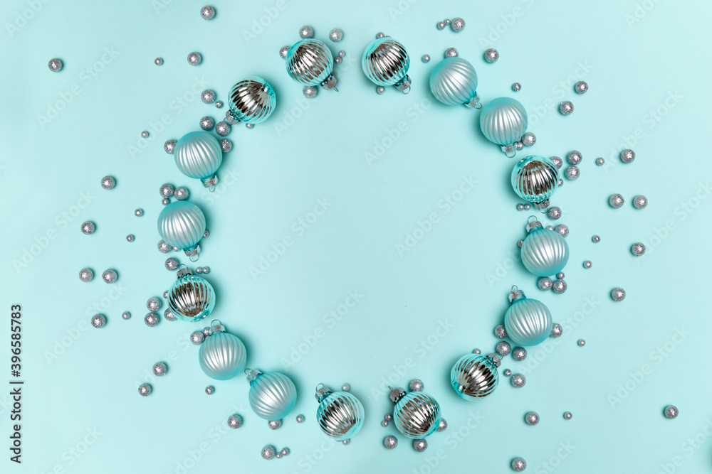 Christmas decorations on turquoise background. Round frame for text. Flat lay, top view, copy space Christmas decorations on turquoise background. Round frame for text. Flat lay, top view, copy space