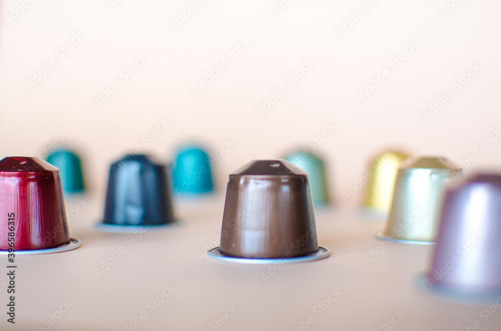 Coffee Capsules with Selective focus on the Brown capsule Coffee Capsules with Selective focus on the Brown capsule