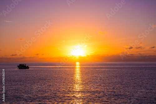 A shot of the sun setting on Grand Cayman.  © drew