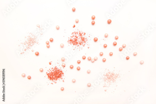 Powder in the balls with a radiant effect on the background of the set for blush. Make-up cosmetics