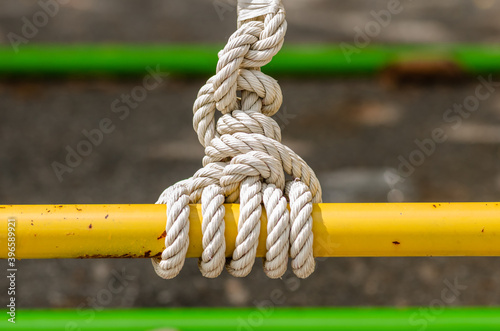 detasil of knot tied on a steel rail