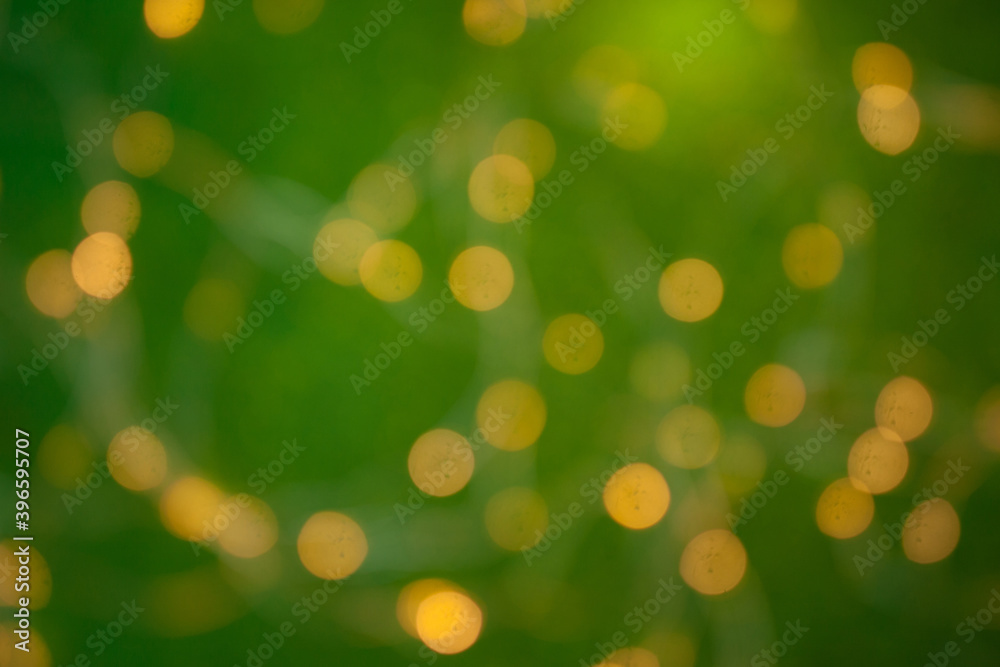 Obraz premium Blurred christmas background. Red bokeh abstract light backdrop. Beautiful images from steam and lights. Magic light bokeh