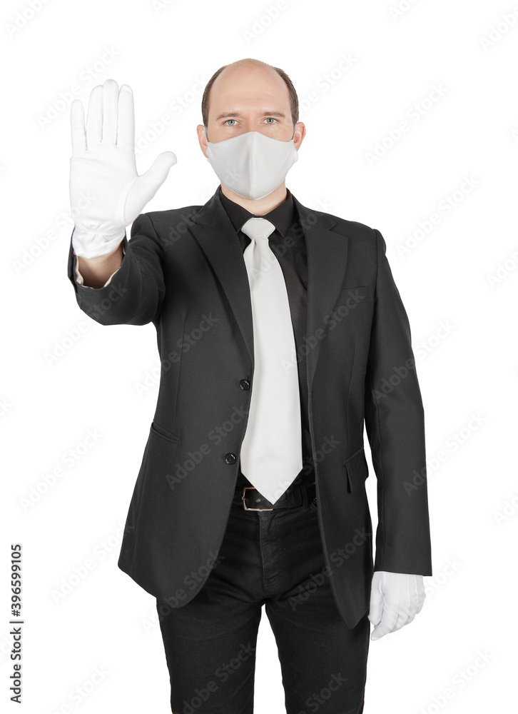 Business man holding surgical medical virus protection mask with white gloves showing stop gesture isolated on white. Business man holding surgical medical virus protection mask with white gloves showing stop gesture isolated on white.
