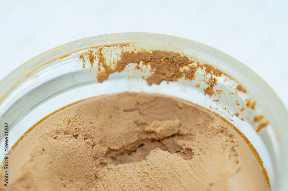 Brown skin care cream in a round jar Brown skin care cream in a round jar