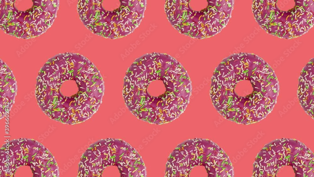 Pink doughnuts seamless pattern on a coral background Pink doughnuts seamless pattern on a coral background
