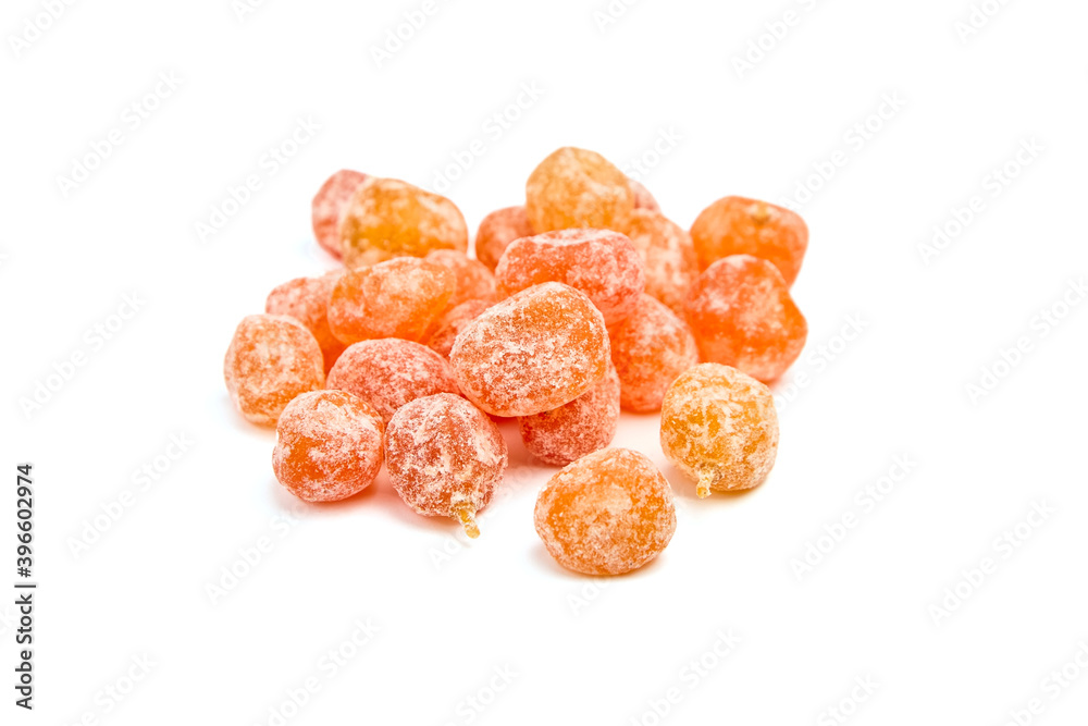 Candied fruits, heap of dried kumquats isolated on white background Candied fruits, heap of dried kumquats isolated on white background